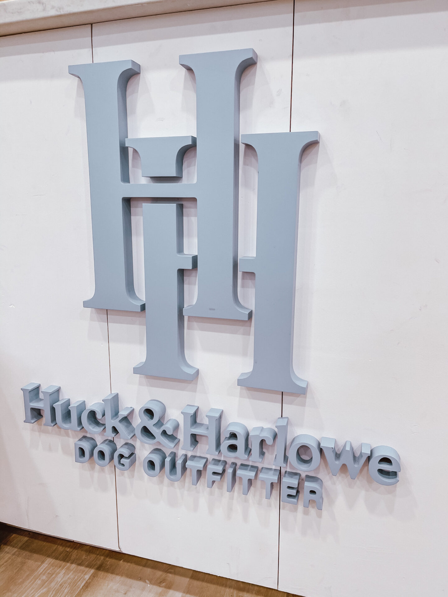 Dog Shops by popular Nashville lifestyle blog, Hello Happiness: image of a Huck and Harlowe sign. 