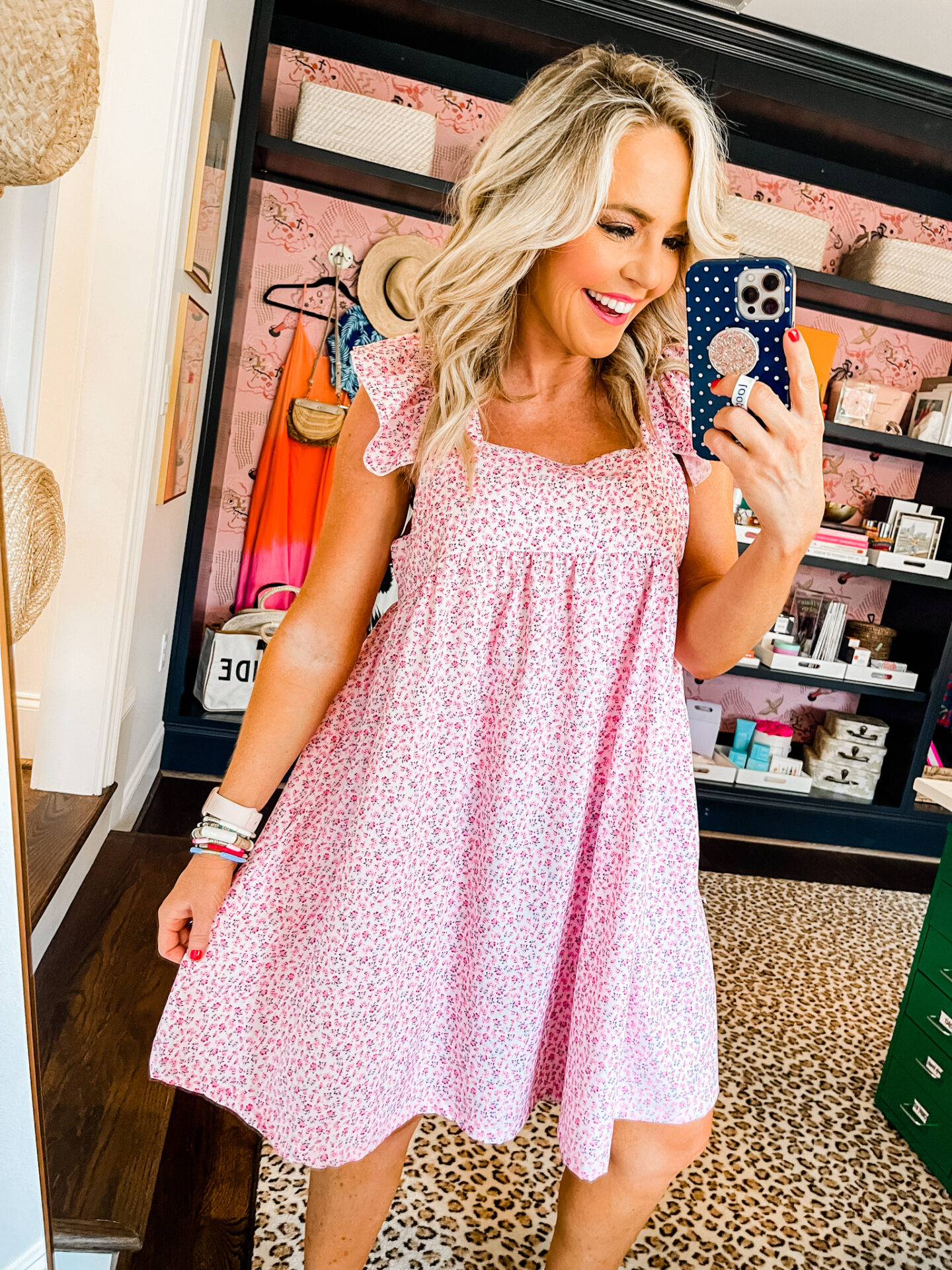 Amazon Favorites by popular Nashville life and style blog, Hello Happiness: image of a woman wearing a Amazon floral babydoll tunic dress. 