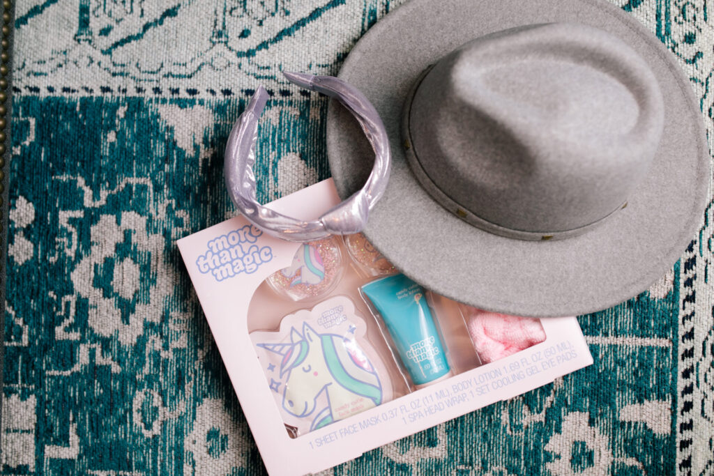 Tween Fashion by popular Nashville fashion blog, Hello Happiness: image of a shiny purple knot headband, grey studded band floppy hat, and More than magic beauty kit. 