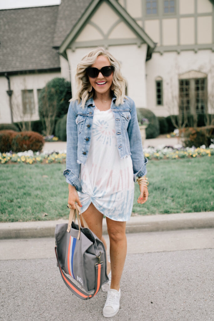 Z Supply by popular Nashville fashion blog, Hello Happiness: image of a woman wearing a Z Supply Naibi cropped jacket, tie dye side knot dress, tote-ally bag, and rezza sneakers.