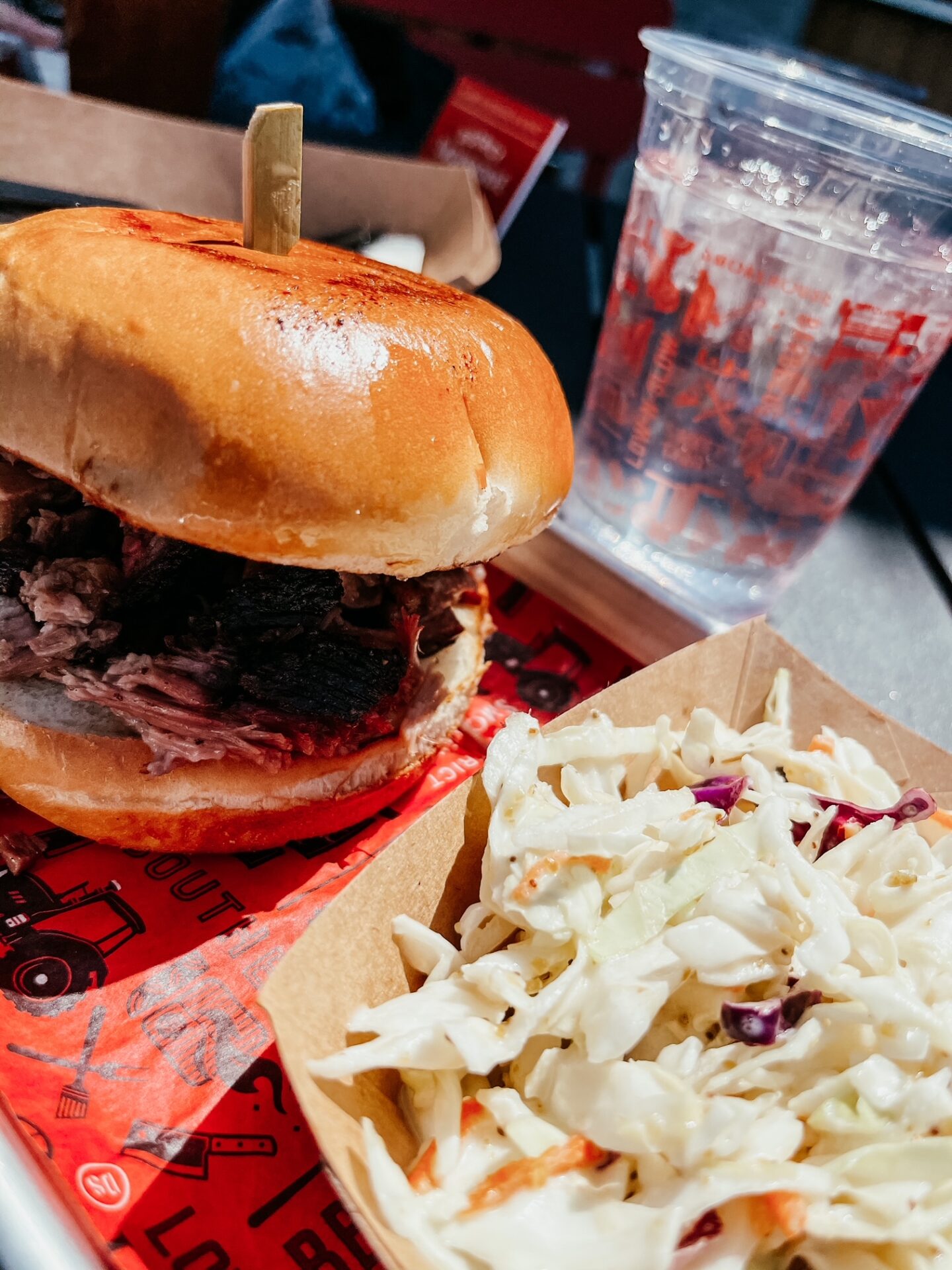 Girls Getaway by popular Nashville travel blog, Hello Happiness: image of a pulled pork sandwich and coleslaw. 