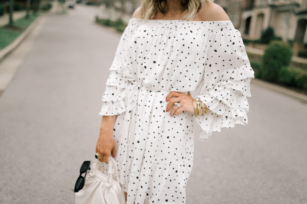 Vici Collection Polka Dot Dress by popular Nashville fashion blog, Hello Happiness: image of a woman wearing a Vici ENCHANTED OFF THE SHOULDER POLKA DOT DRESS, Vici NOE VALLEY PYTHON PLATFORM ESPADRILLE SANDAL, and Vici MOSCOW EMBOSSED CROSSBODY POUCH BAG.