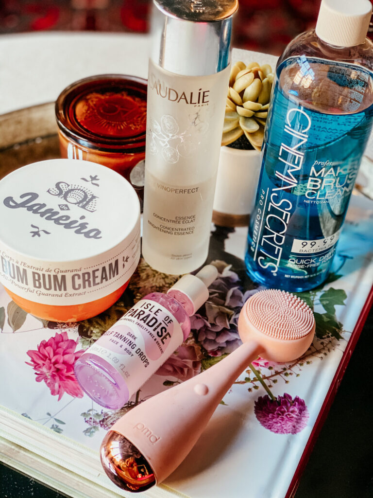 Sephora Spring Sale by popular Nashville beauty blog, Hello Happiness: image of Isle of Paradise self tanning drops, Sol Janeira bum bum cream, Caudalie brightening essence, PMD beauty cleansing brush, and Cinema secrets makeup brush cleaner.  