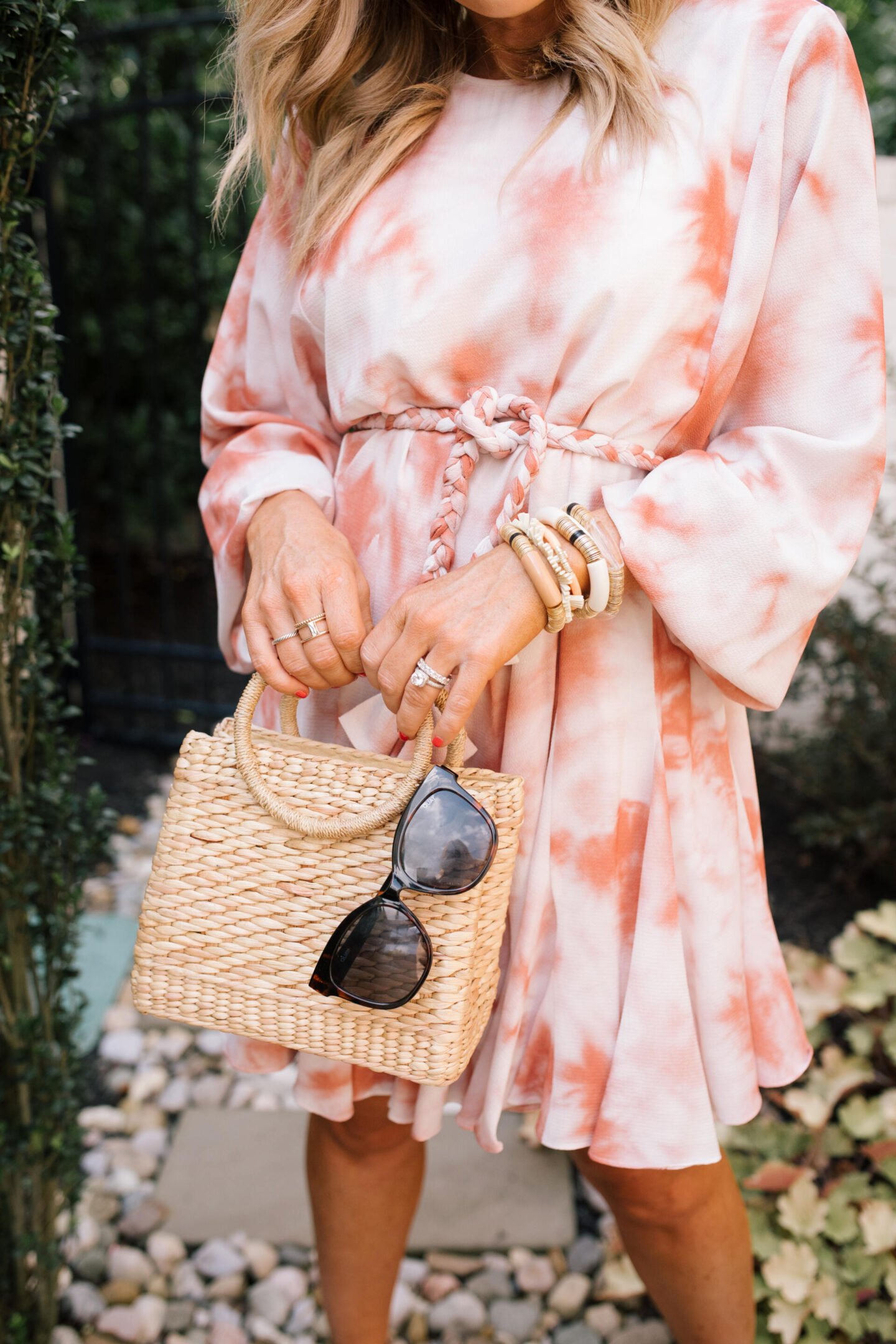 Orange Fashion by popular Nashville fashion blog, Hello Happiness: image of a woman wearing an orange, pink and white tie dye dress, white platform espadrille sandals, and oversized tortoise shell frame sunglasses. 