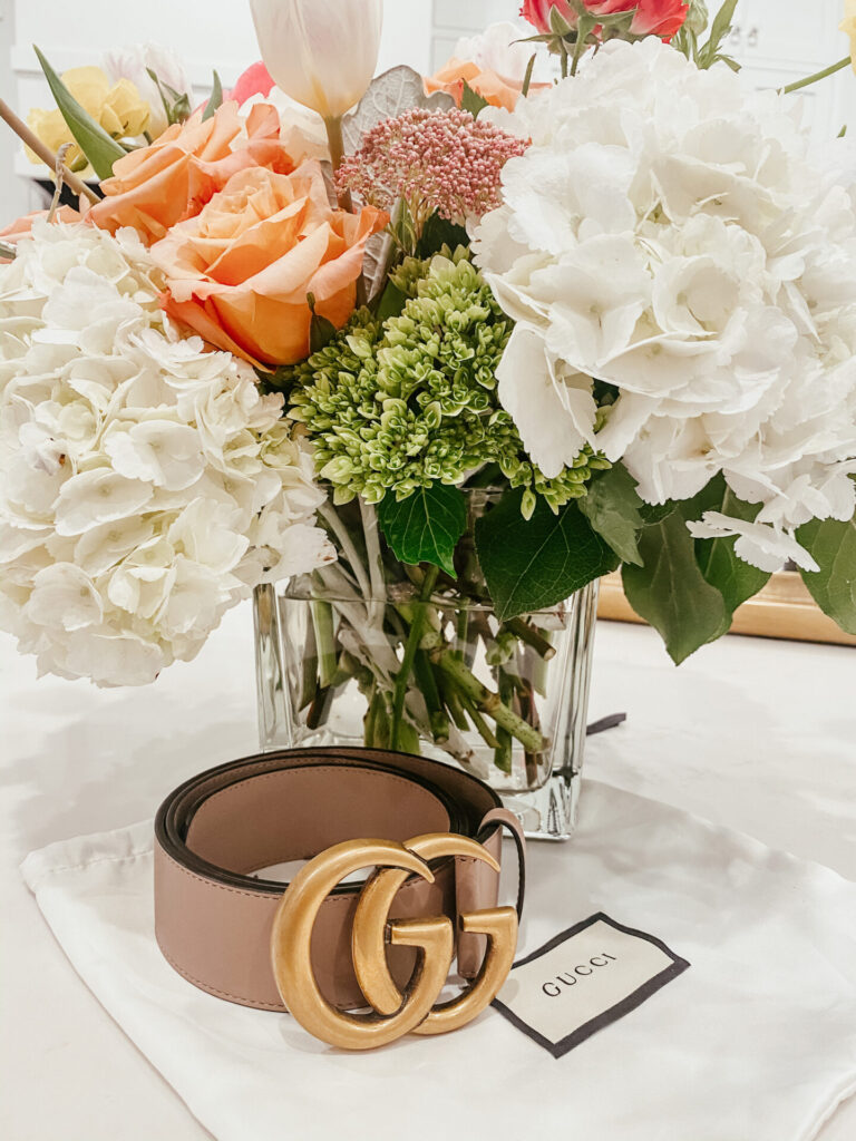 Mother's Day Gift Ideas by popular Nashville life and style blog, Hello Happiness: image of a Gucci bled and a vase of flowers. 