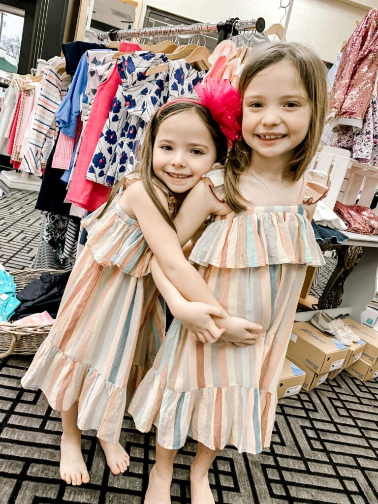 How to Support Small Business: image of a two little girls wearing matching stripe dresses from Plaid Rabbit. 