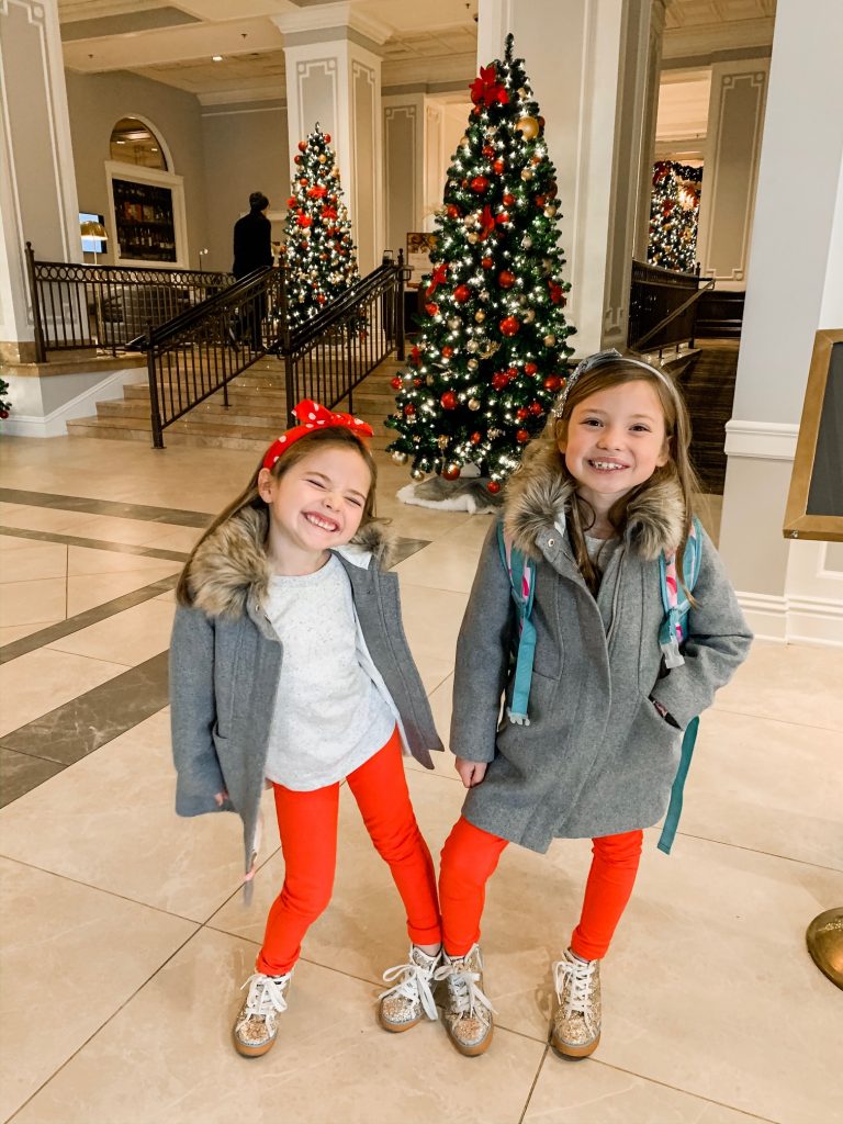 Meet Me for a Weekend in St. Louis | The Perfect Family Getaway by popular travel blog, Hello Happiness: image of two girls standing in the entry way of the The Chase Park Plaza Royal Sonesta Hotel.