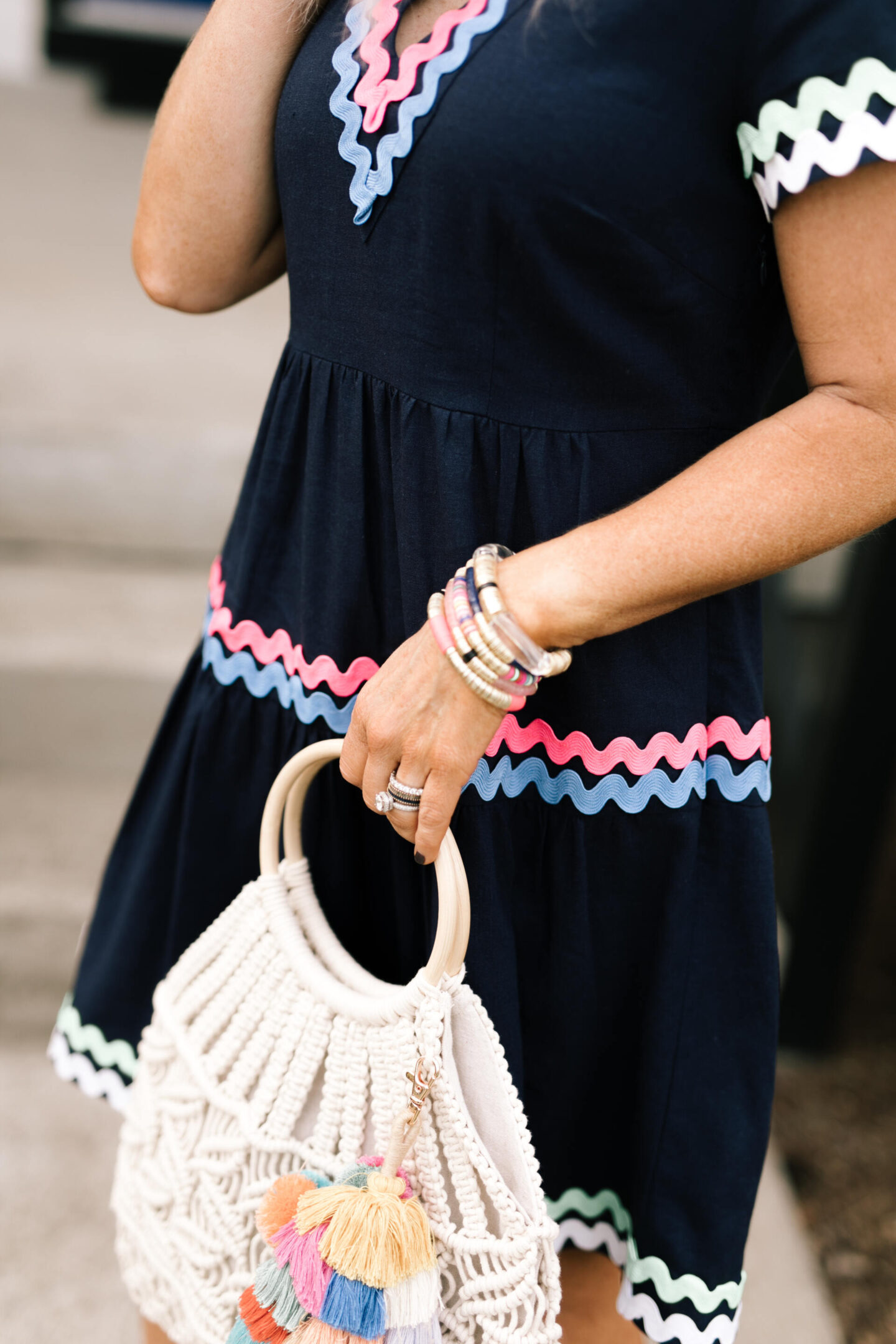 Sail to Sable by popular Nashville fashion blog, Hello Happiness: collage image of Natasha Stoneking wearing a Sail to Sable Ric Rac dress, Quay sunglasses and carrying a cotton cord bag with a tassel charm. 