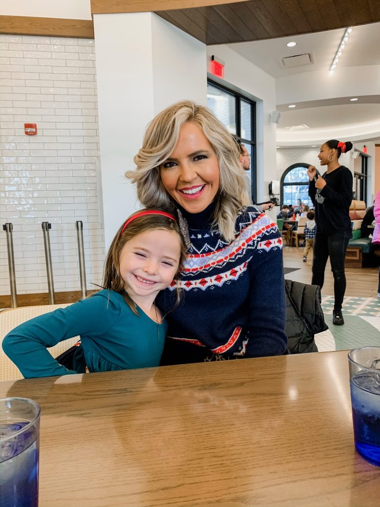 Meet Me for a Weekend in St. Louis | The Perfect Family Getaway by popular travel blog, Hello Happiness: image of a mom sitting with her daughter at the Soda Fountain and wearing a J. Crew Women's rollneck™ sweater in Fair Isle.