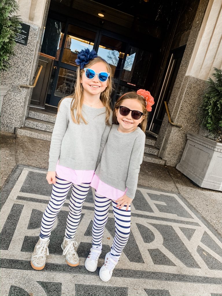 Meet Me for a Weekend in St. Louis | The Perfect Family Getaway by popular travel blog, Hello Happiness: image of two girls standing outside of the Chase Park Plaza. 