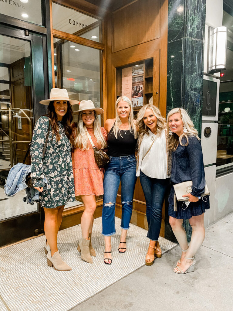 Staycation Ideas by popular Nashville travel blog, Hello Happiness: image of five women standing together in front of a coffee shop. 