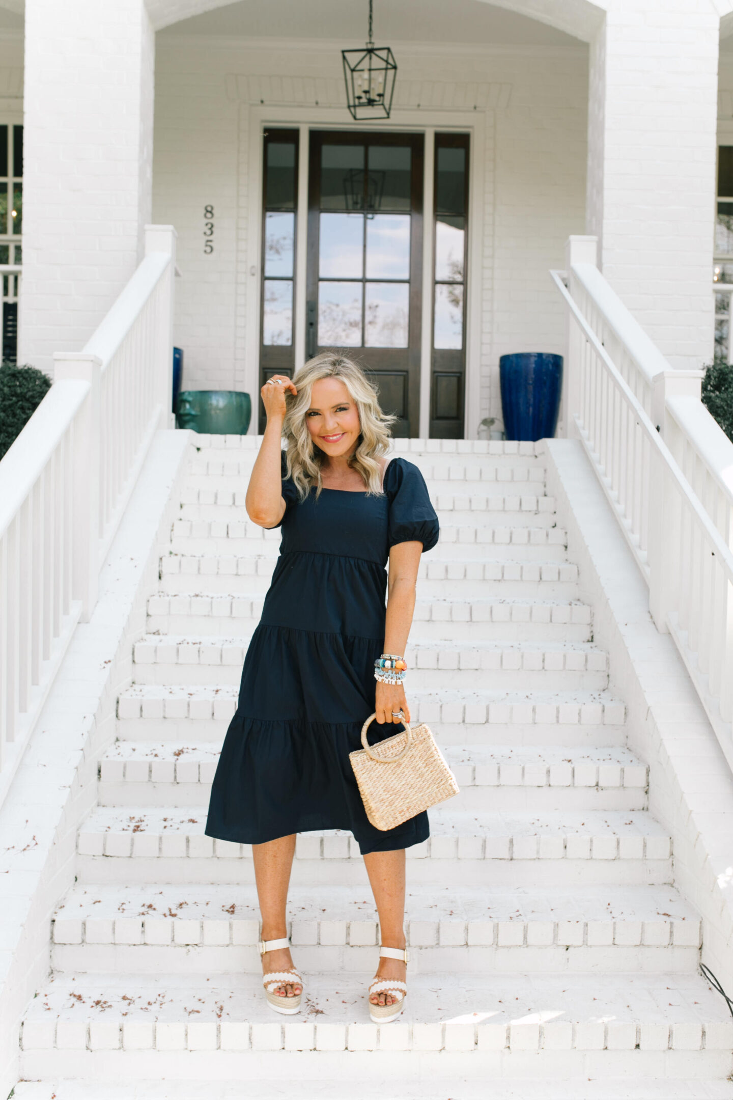New Dress by popular Nashville lifestyle blog, Hello Happiness: image of a woman wearing a puff sleeve dress, zig zag glyn wedges, wipe out bracelet, island in the sun bracelet set, and holding a luna bag. 