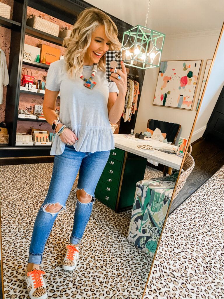 Memorial Day Sales by popular Nashville fashion blog, Hello Happiness: image of a woman wearing a Loft mixed media top. 