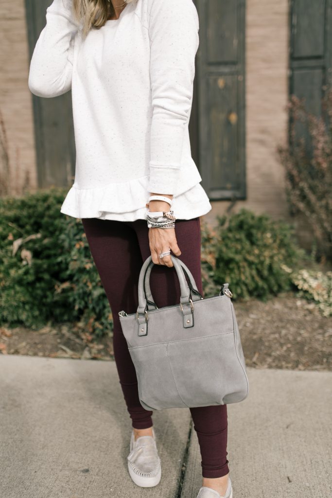  The 12 Days of YAY from Loft... $25 Sweatshirts + Fleece by popular Nashville fashion blog, Hello Happiness: image of a woman outside wearing a Loft FUNNEL NECK SWEATSHIRT and Loft HIGH WAIST LEGGINGS IN SEAMED PONTE.