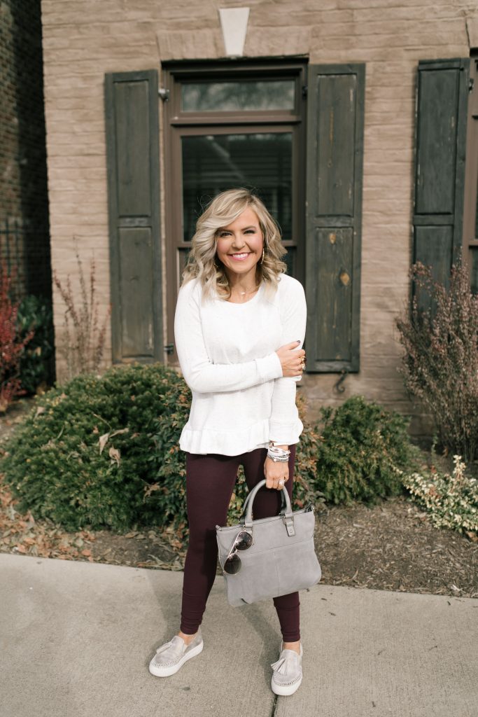  The 12 Days of YAY from Loft... $25 Sweatshirts + Fleece by popular Nashville fashion blog, Hello Happiness: image of a woman outside wearing a Loft FUNNEL NECK SWEATSHIRT and Loft HIGH WAIST LEGGINGS IN SEAMED PONTE.