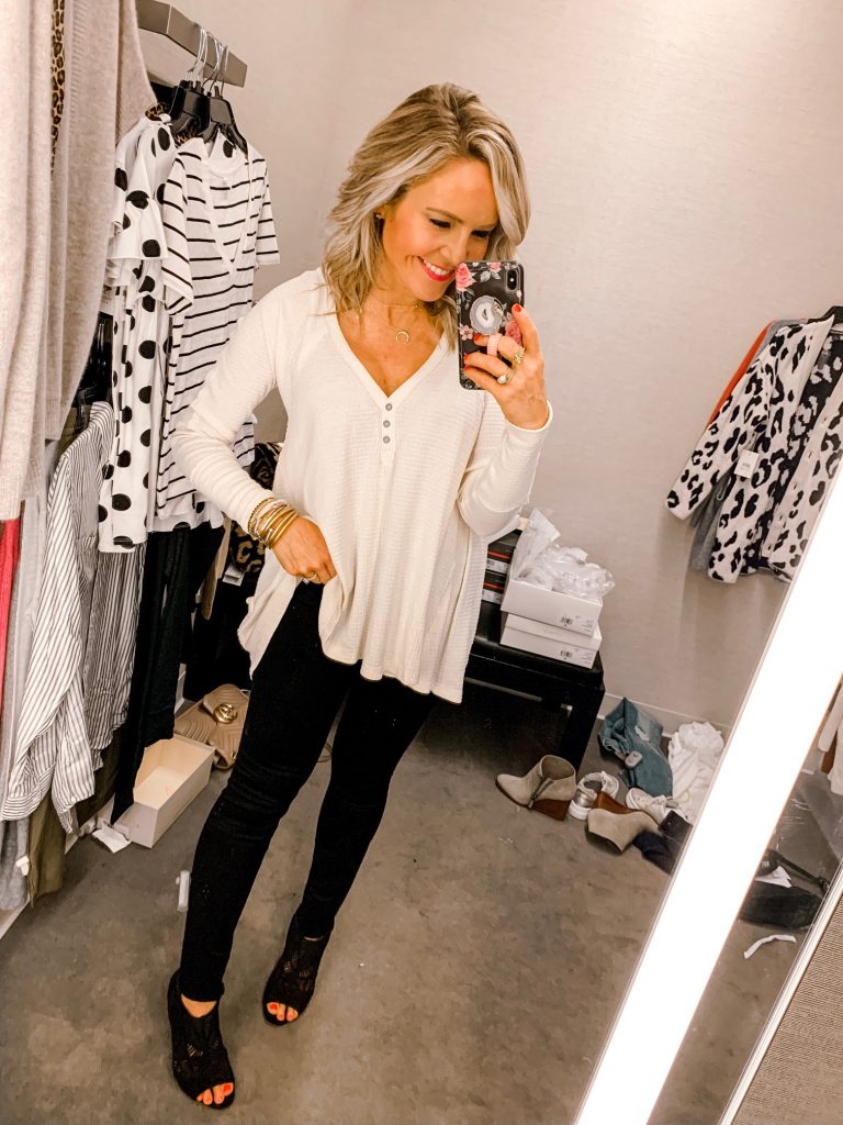 It's LIVE, The 2019 Nordstrom Anniversary Sale... First Look Favs + Dressing Room Diaries by popular Nashville fashion blog, Hello Happiness: image of a woman standing in a Nordstrom dressing room and wearing a Free People Citrine Tee and Madewell Black Denim 9-Inch High Rise Skinny Jeans w/Unfinished Hem.