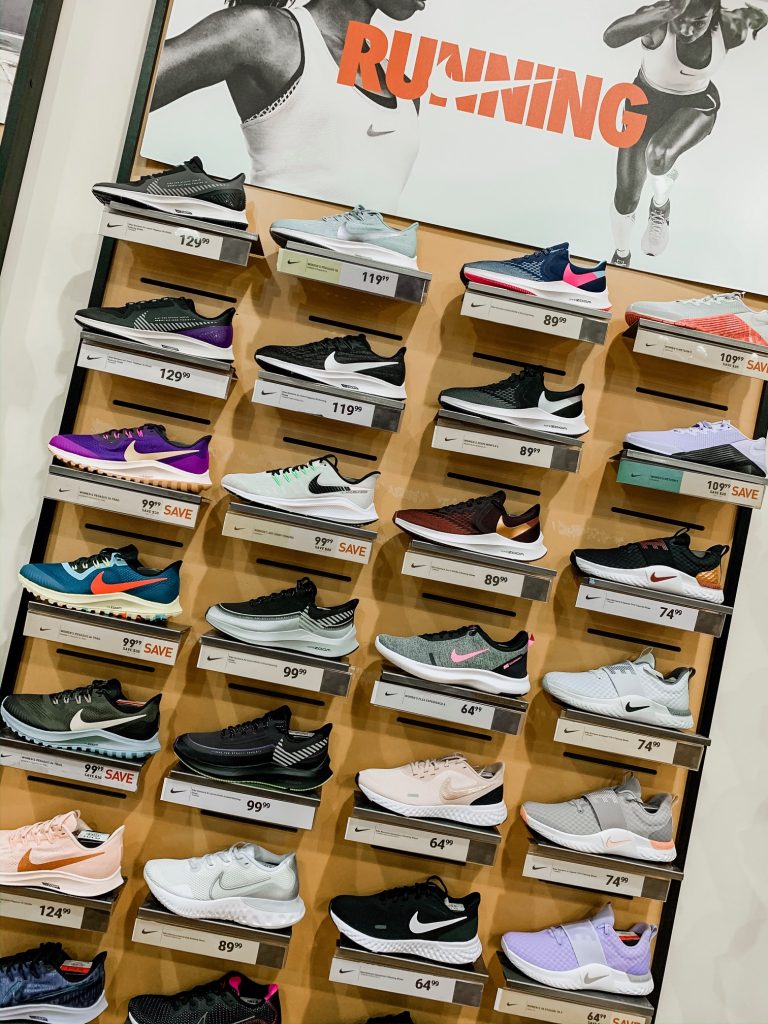 Unwrap the Magic of Sports with Dick's Gift Ideas by popular Nashville life and style blog, Hello Happiness: image of Dick's running footwear display.  