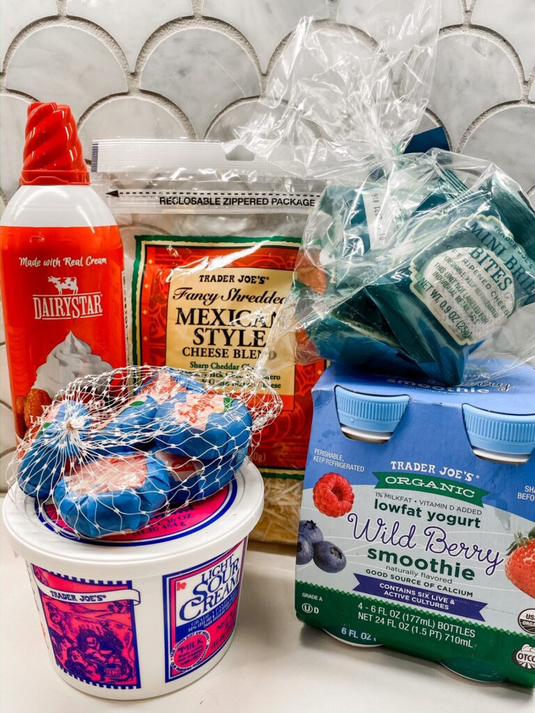 Trader Joe's Haul by popular Nashville lifestyle blog, Hello Happiness: image of sour cream, Trader Joe's Organic wild berry smoothie, whipped cream, and Trader Joe's Fancy Shredders Mexican Style cheese blend. 