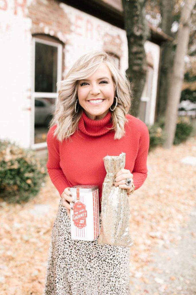 Shop Small Saturday 2019 by popular Nashville life and style blog, Hello Happiness: image of a woman holding a Christie Cookie tin. 