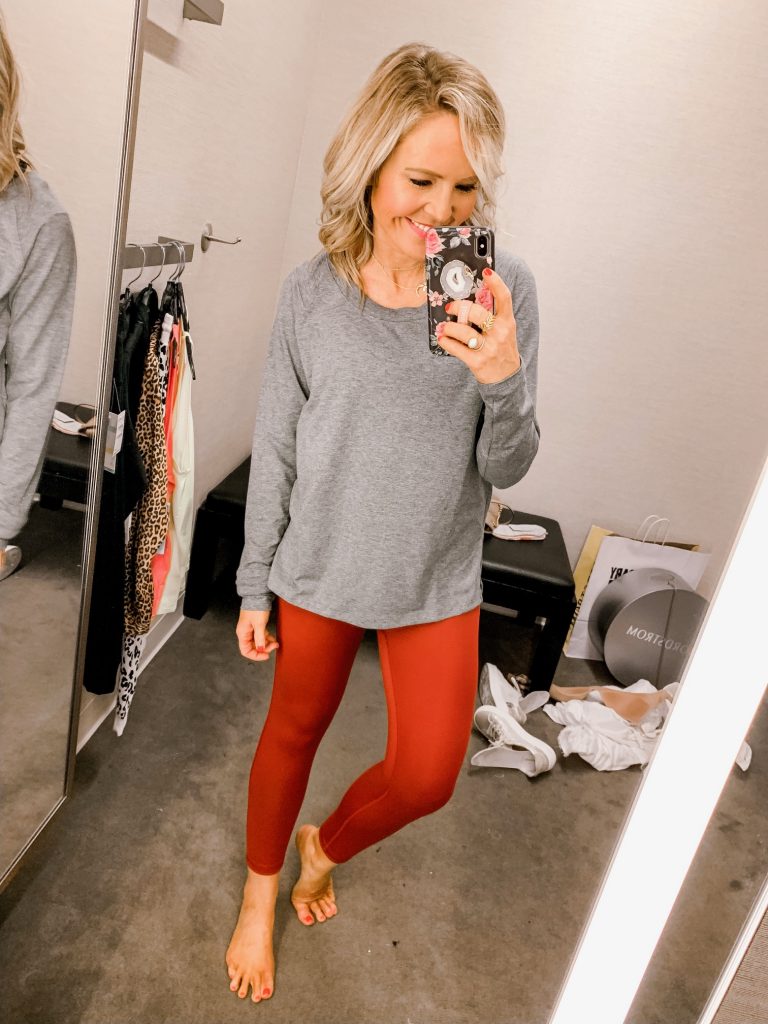 It's LIVE, The 2019 Nordstrom Anniversary Sale... First Look Favs + Dressing Room Diaries by popular Nashville fashion blog, Hello Happiness: image of a woman standing in a Nordstrom dressing room and wearing a Zella Karly Long Sleeve Tee and Zella High Waist Ribbed Legging. 