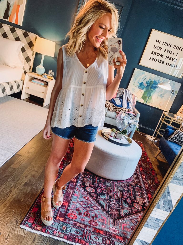 Amazon Fashion Favorites featured by top US fashion blog Hello! Happiness; Image of a woman wearing a white scalloped top and jean shorts from Amazon.