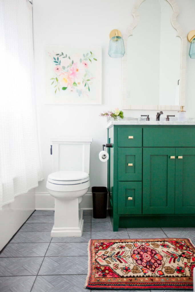 Home Paint Colors by popular Nashville life and style blog, Hello Happiness: image of a guest bathroom painted in Sherwin Williams Shamrock SW 6454.
