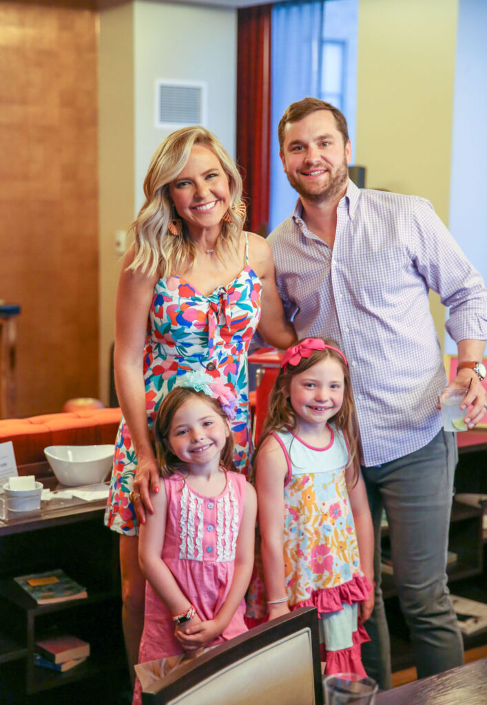 What COVID-19 Has Taught Me by popular Nashville lifestyle blog, Hello Happiness: image of a woman, her husband, and her two daughters standing together in a restaurant. 