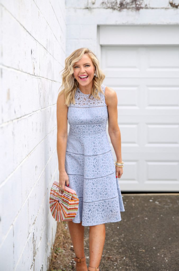 Cute Spring Dresses featured by top US fashion blog Hello! Happiness; Image of a woman wearing Eliza J Dress, Rainbow Bamboo Bag, Crescent Bangle, Savannah Bangle, Pearl Cable Classic Bracelet, Blue Topaz Cable Bracelet, White Flower Earrings, Pink Luna Sunglasses and Eyelet Wedges.
