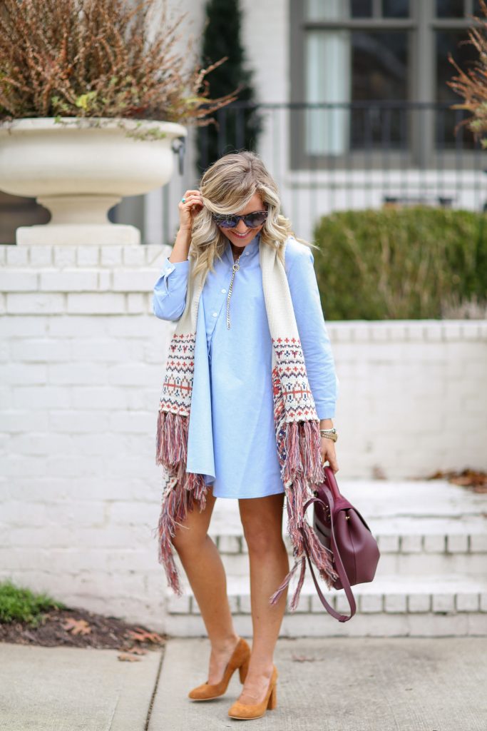 Cute Spring Dresses featured by top US fashion blog Hello! Happiness; Image of a woman wearing BB Dakota dress, Jude Nordic fringe vest, ABLE heels, Luna sunglasses and Polene bag.