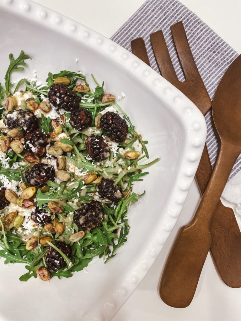 Blackberry Goat Cheese Salad by popular Nashville life and style blog, Hello Happiness: image of a blackberry goat cheese salad in a Pottery Barn Emma Beaded Footed Serving Bowl next to a Pottery Barn Vintage Wood Serving Set.