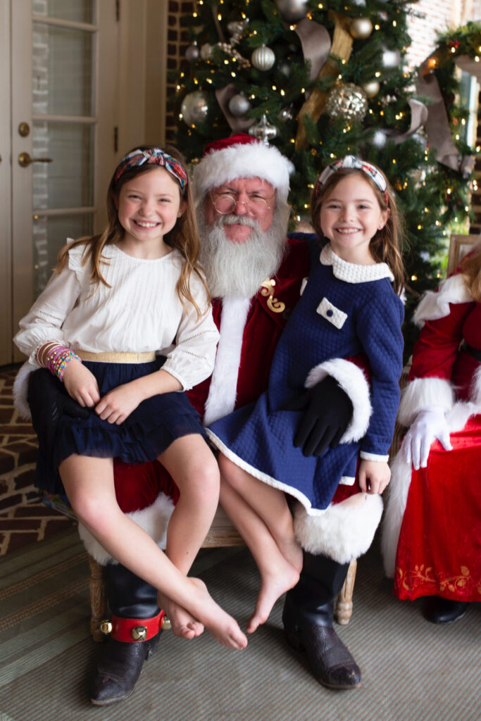 Year in Review by popular Nashville lifestyle blog, Hello Happiness: image of two young girls sitting on Santa's lap. 
